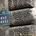 Close-up of Rue Pavée and medieval wall